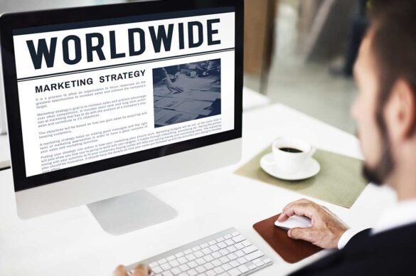 A man reading about marketing strategy on laptop I LegalTechMunch