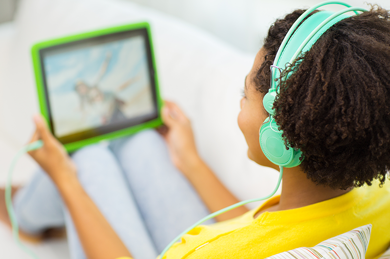 Girl streaming HOOQ on tab | LegalTechMunch