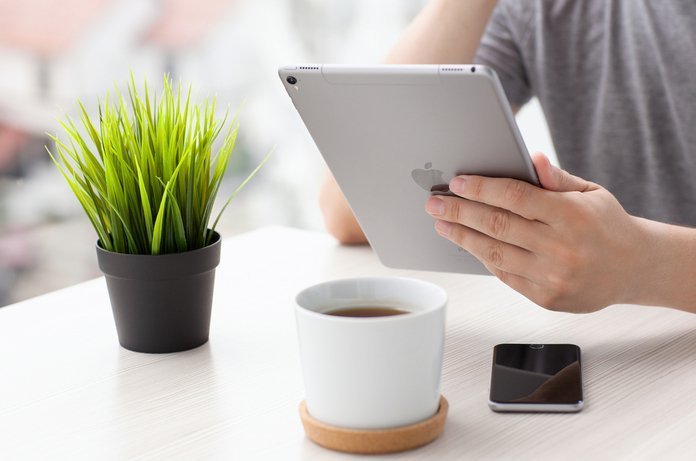 A Man Using an iPad | LegalTechMunch