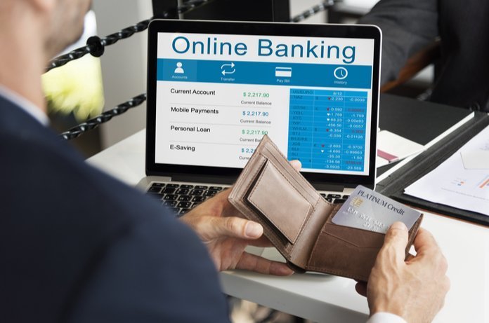 Online Banking Laptop and Wallet with a Credit Card | LegalTechMunch