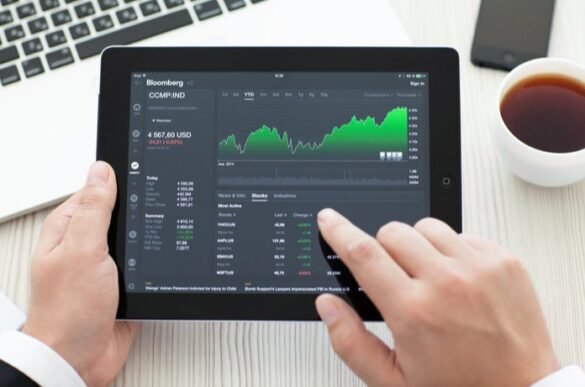 A man using tablet to analyze the stocks of the company I LegalTechMunch