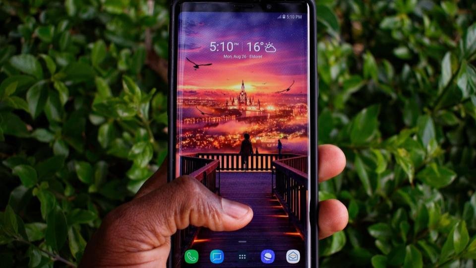A person holding mobile in hand | LegalTechMunch