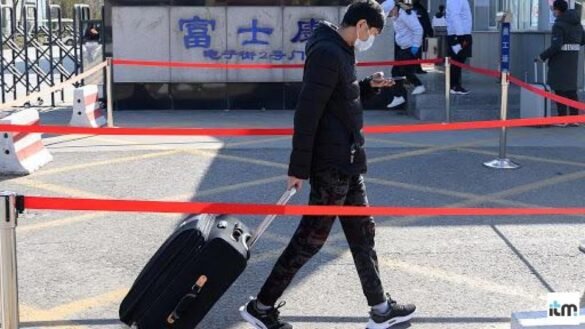 A boy pulling trolley bag- Travelling affected due to coronavirus I LegalTechMunch