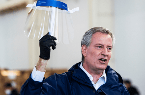 A person holding face shield in his hand | LegalTechMunch