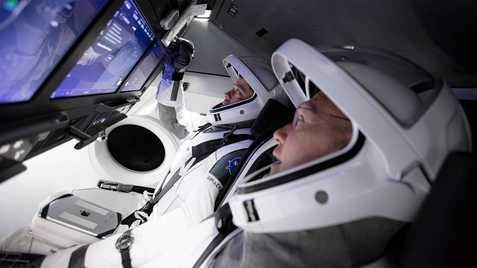 NASA and SpaceX initiated memorable first astronaut launch for May 27 1 Two astrounats looking at the display | LegalTechMunch
