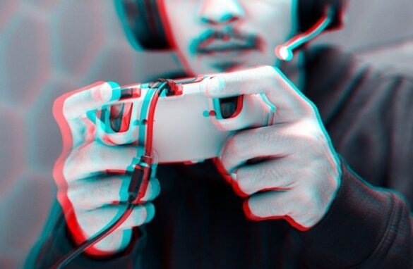 Professional eSport gamer playing a game with gaming controller in double color exposure effect