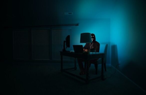 Hacker working in a dark room