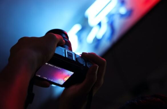 A videographer using a camera to record something