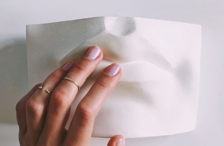 Experiential Marketing: Unique, Fun, and Effective Strategies 2 A woman touching a product's prototype