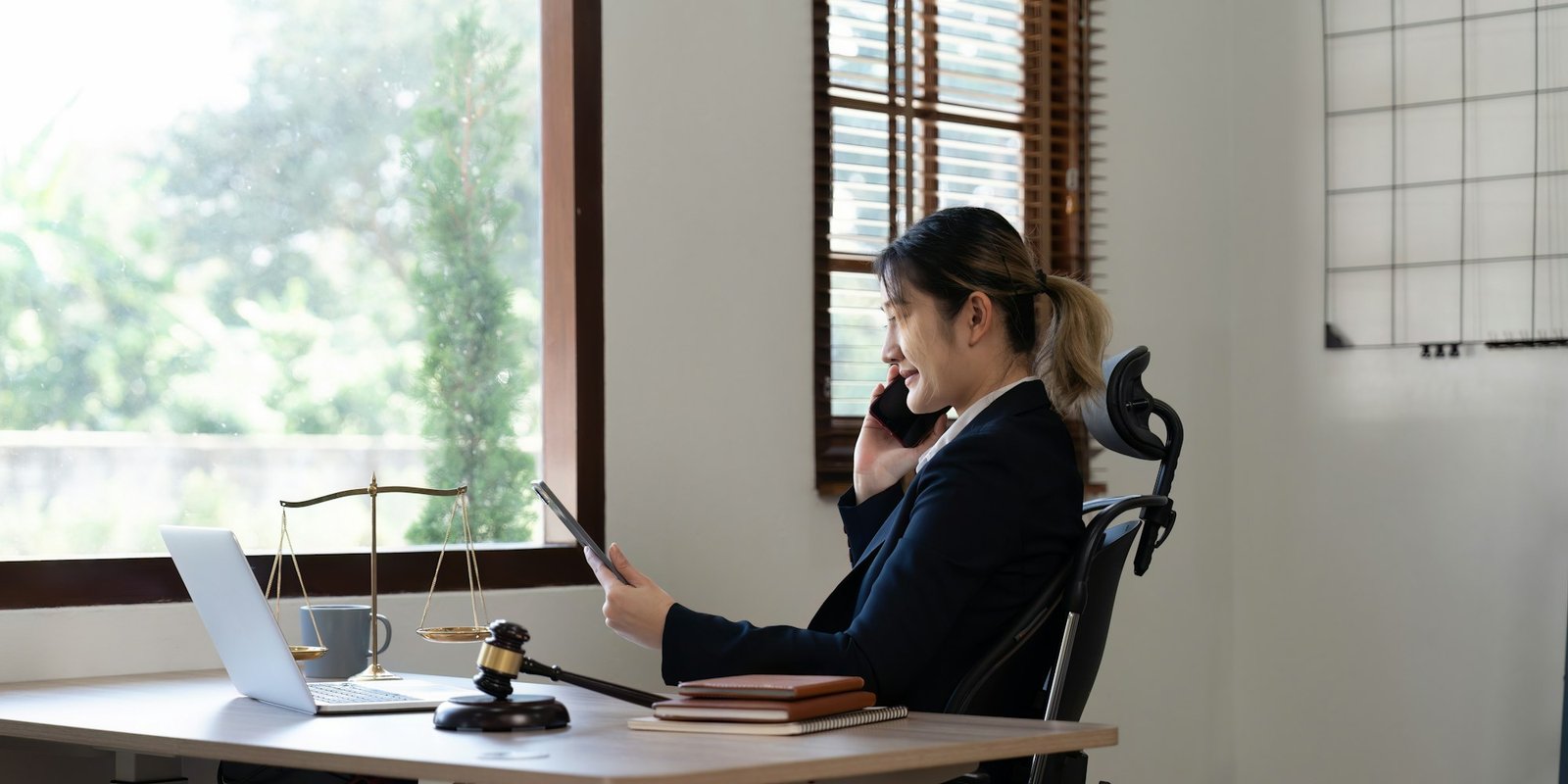 Attractive young lawyer in office Business woman and lawyers call phone in office. Law, legal