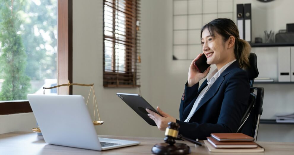 Attractive young lawyer in office Business woman and lawyers call phone in office. Law, legal