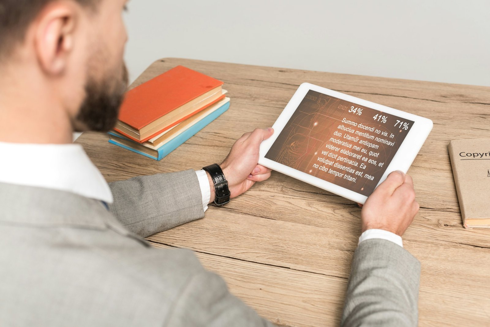 cropped view of businessman using digital tablet with medical app on screen isolated on grey